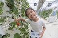 Happy Asian girl with her strawberries