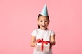 Happy asian girl holding gift box at studio Royalty Free Stock Photo
