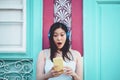 Happy Asian girl listening to music with headphones outdoor - Young Chinese woman playing her favorite playlist music Royalty Free Stock Photo