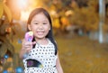 Happy asian girl play bubble soap at home Royalty Free Stock Photo