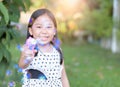 Happy asian girl play bubble soap at home Royalty Free Stock Photo