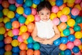 Happy asian girl playing in colorful balls pool Royalty Free Stock Photo