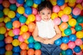 Happy asian girl playing in colorful balls pool Royalty Free Stock Photo