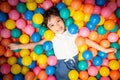 Happy asian girl playing in colorful balls pool Royalty Free Stock Photo