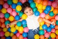 Happy asian girl playing in colorful balls pool Royalty Free Stock Photo