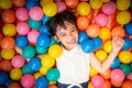 Happy asian girl playing in colorful balls pool Royalty Free Stock Photo