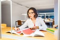 Asian girl student doing homework in library Royalty Free Stock Photo