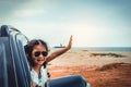 Asian girl smiling while sitting in the car. Travel on vacation Royalty Free Stock Photo