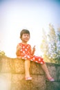 Happy asian girl with thump up and relaxing outdoors in the day Royalty Free Stock Photo