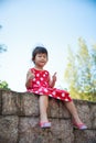 Happy asian girl with thump up and relaxing outdoors in the day Royalty Free Stock Photo