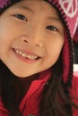 Happy Asian girl in wintry hat