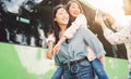 Happy Asian girls having fun outdoor - Millennial young people sharing time together and using mobile smartphone new trendy apps Royalty Free Stock Photo