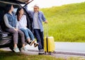 Happy asian group of friends with car travel driving and suitcase Royalty Free Stock Photo