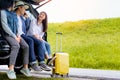 Happy asian group of friends with car travel driving and suitcase Royalty Free Stock Photo