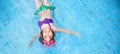 Happy asian kid big smile to playing swim in water pool Royalty Free Stock Photo