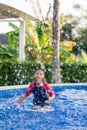 Happy asian kid boy swiming on swiming pool in the summer Royalty Free Stock Photo