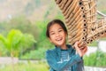 Happy Kid girl looking at camera with smile while playing in public park wooden bamboo playground Royalty Free Stock Photo