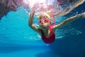 Happy asian kid swimming underwater in summer. Royalty Free Stock Photo