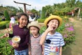 Happy Asian kids eating popcorn in the park Royalty Free Stock Photo