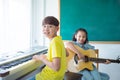 Kids playing Music Instruments and smile In School Royalty Free Stock Photo