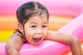 Happy asian little child girl smiling and fun to play water Royalty Free Stock Photo