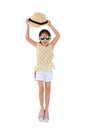 Happy Asian little girl wearing sunglasses and lift up straw hat jumping on white isolated background. Summer and fashion concept Royalty Free Stock Photo