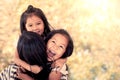 Happy asian little girls hugging mother Royalty Free Stock Photo