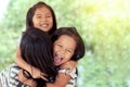 Happy asian little girls hugging mother Royalty Free Stock Photo