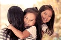 Happy asian little girls hugging mother Royalty Free Stock Photo