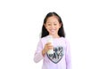 Happy asian little kid girl drinking milk from glass bottle isolated on white background Royalty Free Stock Photo