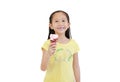 Happy asian little kid girl eating ice cream cone isolated on white background Royalty Free Stock Photo