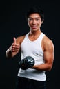 Happy asian man holding dumbbell Royalty Free Stock Photo