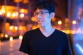 Happy Asian Man Thinking Outdoors At Night Royalty Free Stock Photo