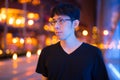 Happy Asian Man Thinking Outdoors At Night Royalty Free Stock Photo