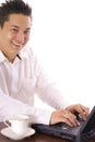 Happy asian man working on computer Royalty Free Stock Photo