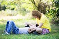 Happy asian mom with cute little boy at the park Royalty Free Stock Photo