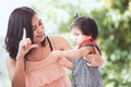 Happy asian mother and cute little baby girl playing together Royalty Free Stock Photo