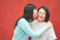 Happy Asian mother and daughter having fun outdoor - Portrait family people spending time together outside Royalty Free Stock Photo