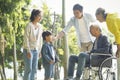 Happy asian multi generation family relaxing outdoors Royalty Free Stock Photo