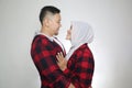 Happy Asian muslim couple hugging embracing each other, husband and wife love romance relationship