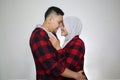 Happy Asian muslim couple hugging embracing each other, husband and wife love romance relationship