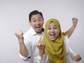 Happy Asian Muslim Couple Shows Winning Gesture Royalty Free Stock Photo