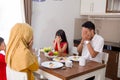 Asian muslim family pray before eating Royalty Free Stock Photo