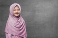 Happy asian muslim kid wearing hijab with smiley face Royalty Free Stock Photo