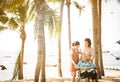 Happy asian old elderly relaxing enjoying a beautiful view by the sea beach on vacation,smiling senior woman with family strolling