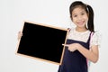 Happy Asian preteens girl hand holding wood board