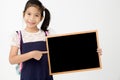 Happy Asian preteens girl hand holding wood board Royalty Free Stock Photo