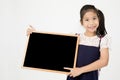 Happy Asian preteens girl hand holding wood board