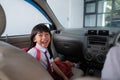 happy asian primary student while going to school by car Royalty Free Stock Photo