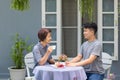 Happy asian retired mother with her adult son are relax talking together in morning at home. Royalty Free Stock Photo